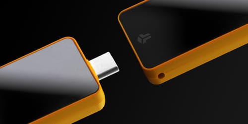 Black and orange hardware crypto wallet with USB-C connector